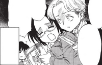 Nanaba threateningly holds a knife up to Hange
