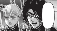 Armin stands beside Hange on the airship