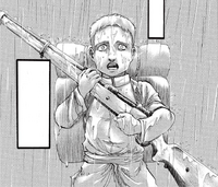 Young Reiner holds a large rifle