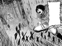 Mikasa arrives to see Annie having eaten Eren