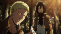 Mikasa watches as Reiner investigates a campfire