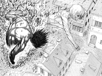 The Attack Titan bursts through the ground