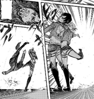 Eren is kicked by Annie