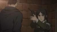 Eren is held at gunpoint by Pieck