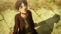 A young Eren gazes at the sky