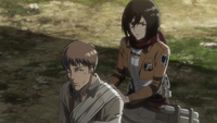 Jean is bandaged by Mikasa