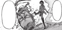 Hange kicks a severed Titan head