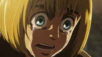 A traumatized Armin cries