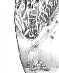The Colossus Titan falls down on Eren