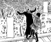 Hange holds Nick over the edge of the Walls