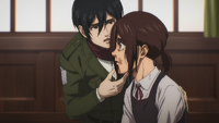 Mikasa looks over Gabi's injuries