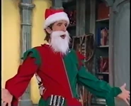 Schemer in his Santa's Helper outfit