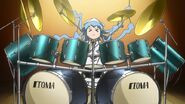 Ika playing the drums.