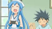 Ika Musume and Takeru playing video games.