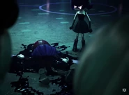 V and Uzi standing around Doll's corpse