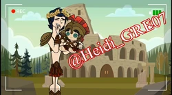 Jake holding a Gladiator Tom Plushie.