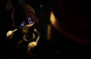 Doll saluting to Uzi with V next to her