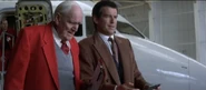 Bond testing the remote-control car alongside Q - Tomorrow Never Dies