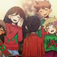 Hero and Mari wearing matching sweaters