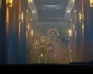 Doll unlocking the entrances for the Sentinels above Uzi and V