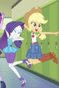 Rarity and Applejack jumping up for a picture