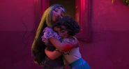 Isabela and Mirabel embrace, fulfilling Bruno's vision