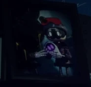 A picture frame displaying the Doorman Family with Nori's face burnt out.