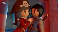 Ruby leans on Alex after he told her that there might be a big treasure inside Dr. X's vault in Episode "Gene's Four"