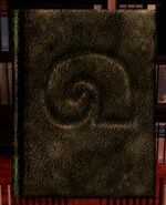 Translation of Ixupi legend. Black book with symbol for Ixupi tomb on it.