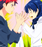 Sōma claps Megumi's hands (anime)