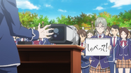 Nene holding a sign during the announcement for the Promotion Exams. (Episode 50)