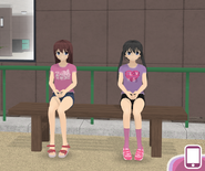 The protagonist and girlfriend sitting on a bench