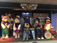 The 1-Stage in Levittown, Pennsylvania with sign removed and Chuck E. Cheese in his Avenger uniform. (Now closed).