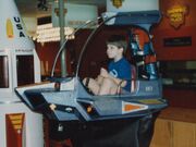 Child on ride at ShowBiz Pizza in Fayetteville, Arkansas