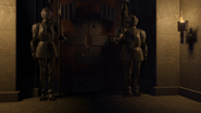 Two guards stand outside the dungeon