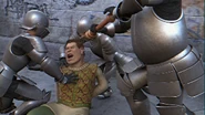 Shrek yells in pain as pepper stings his eyes.