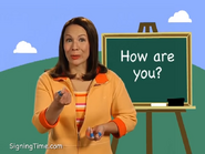 How are you? Or, How are you doing? First, sign how. Put your fingers together, thumbs up, and then roll them forward. How. Then point: you. How are you? How are you?