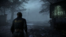 Murphy walking past the 'Welcome to Silent Hill' sign.