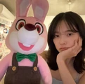 Konatsu with a Robbie the Rabbit plush.