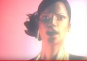 Cynthia singing in her music video.