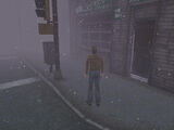 Harry Mason in front of Andy's Books in Silent Hill.