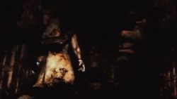 Pyramid Head dragging a Mannequin.