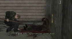 James picking up the key near the corpse.