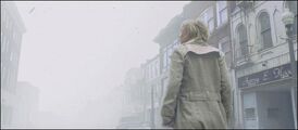 Rose wanders the streets of Silent Hill.