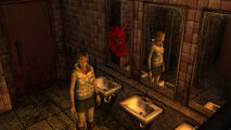 The player regains control over Heather in this bathroom, facing a save point.