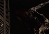 Pyramid Head reacts to being fired at by James.