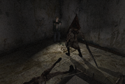 James fends off Pyramid Head with his handgun.