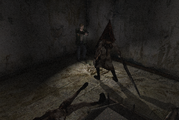 James fends off Pyramid Head with his Handgun.