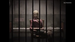 Maria looks through the bars.