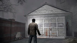 Alex in front of his garage.